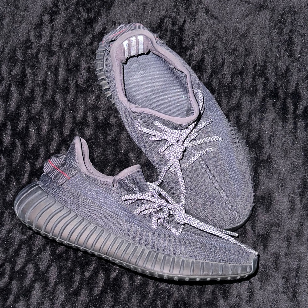 Yeezy Boost 350 in all black. Reflective.